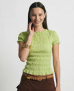 Women’s plaid top by FJØRNA featuring ruffle details, casual style, and lightweight fabric, perfect for everyday wear.