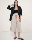 FJØRNA women's linen wide-leg trousers with drawstring, showing fabric texture and relaxed fit, casual stylish pants for women.