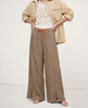 FJØRNA linen wide-leg women’s trousers with drawstring, showing soft fabric texture and relaxed fit on a model.