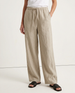 FJØRNA women's knit top displayed with stylish pants, showcasing soft fabric texture and comfortable fit.