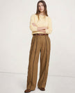 FJØRNA women's linen wide-leg trousers with elastic waist, showcasing soft, high-quality linen fabric and relaxed fit.