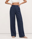 FJØRNA linen blend wide-leg high-waist women's trousers showing fabric quality and realistic texture.