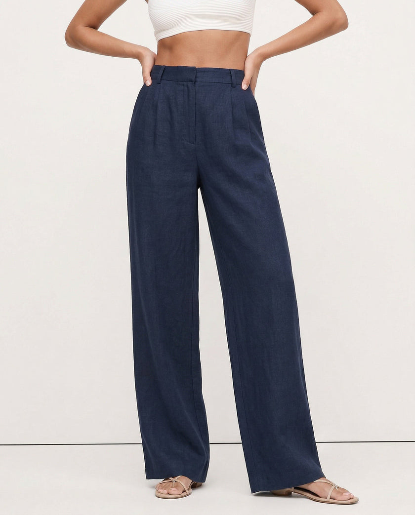 FJØRNA linen blend wide-leg high-waist women's trousers showing fabric quality and realistic texture.