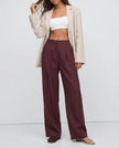 FJØRNA linen blend women's wide-leg high-waist trousers showing fabric quality and realistic texture.