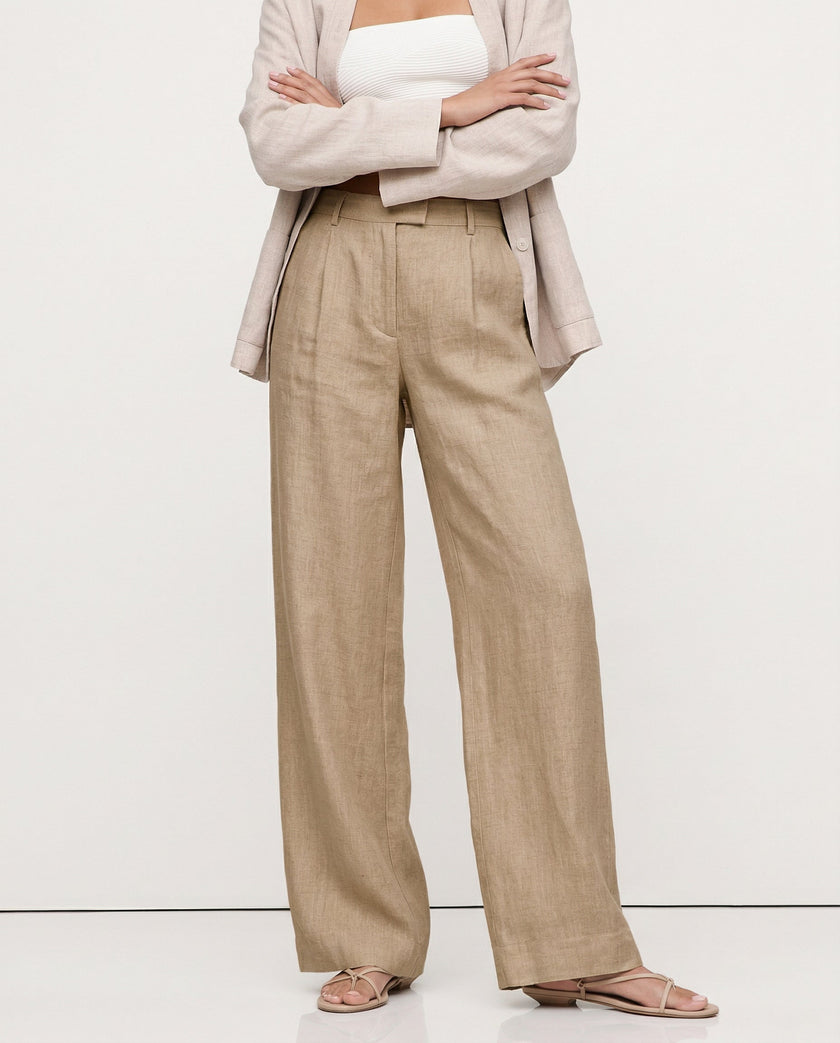 FJØRNA linen blend wide-leg high-waist women's trousers showing fabric quality and realistic linen texture.