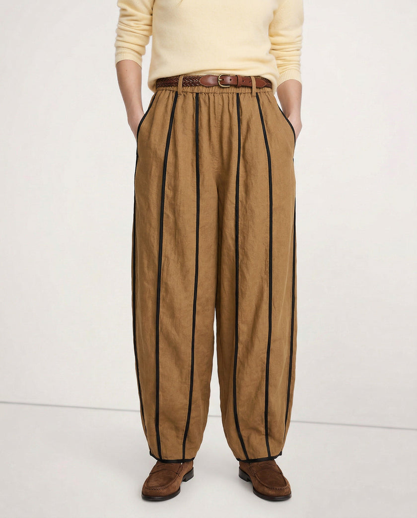 FJØRNA women's linen wide-leg trousers with elastic waist, showcasing high-quality, realistic linen fabric and relaxed fit.