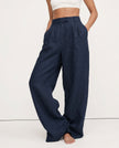 FJØRNA linen blend women's wide-leg high-waist trousers showcasing fabric texture and stylish relaxed fit.