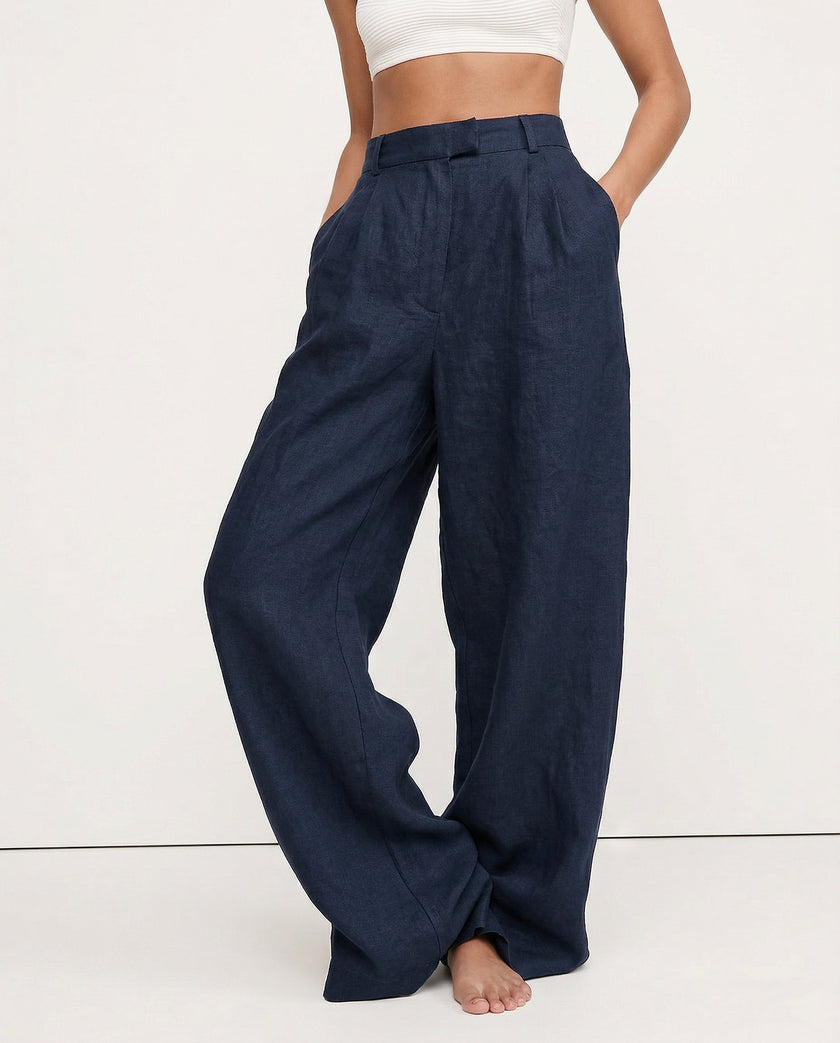 FJØRNA linen blend women's wide-leg high-waist trousers showcasing fabric texture and stylish relaxed fit.