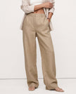 FJØRNA linen blend women's wide-leg high-waist trousers showing breathable fabric and stylish fit on a model.