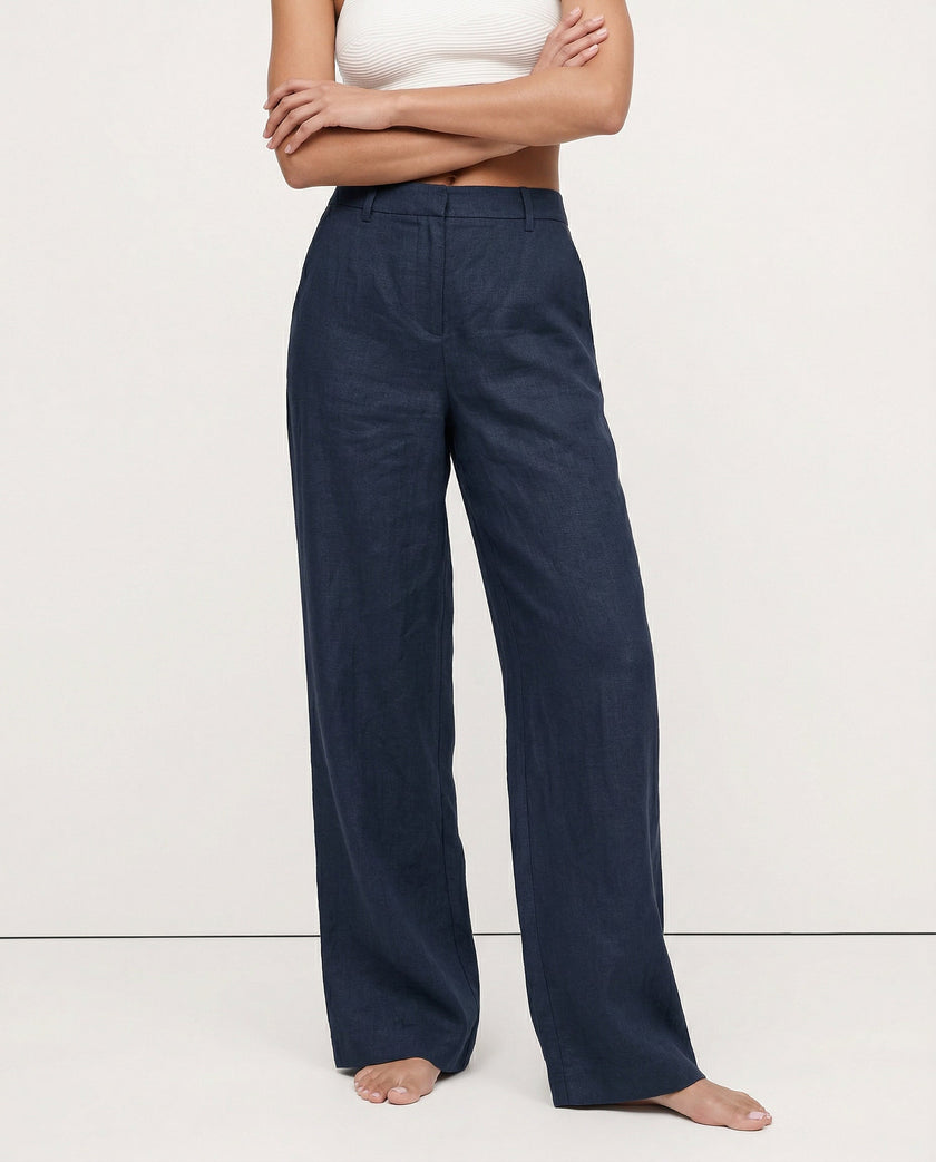 FJØRNA women's linen blend wide-leg high-waist trousers, showcasing the fabric's quality and realistic texture.