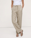 Women’s knit top from FJØRNA featuring a cozy, fitted design in a neutral color, styled with the new pants on the model.