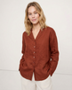 FJØRNA women's linen V-neck shirt, lightweight and airy, model wearing the stylish slip-on top in a casual setting.