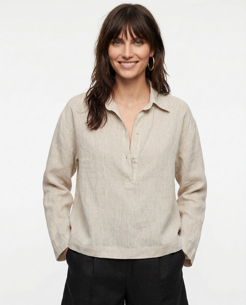 Women’s linen polo top with collar by FJØRNA, shown on a model, featuring a relaxed fit and lightweight, breathable fabric.