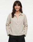 FJØRNA women's linen polo top with collar, lightweight and breathable, styled on a model showcasing its relaxed fit and natural fabric.
