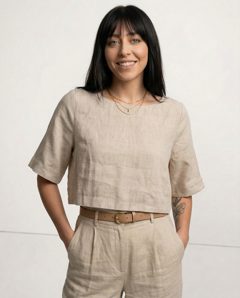 FJØRNA women's linen crop top with short sleeves, lightweight and stylish for casual wear, shown on a model.
