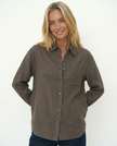 Women’s linen blend shirt by FJØRNA, casual top featuring lightweight fabric and relaxed fit, worn by a model.