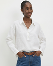 FJØRNA women's linen polo top with collar, stylish and lightweight, worn by a model, perfect for casual or smart-casual outfits.