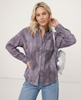FJØRNA linen shirt for women with pleated design, lightweight and stylish top worn by a model, perfect for casual or summer wear.