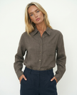 Women’s linen blend shirt by FJØRNA, stylish and breathable top worn by model, featuring a relaxed fit and natural fabric texture.