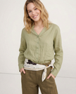 FJØRNA women's linen V-neck shirt, lightweight and breathable top, worn by a model, showcasing relaxed fit and natural fabric.