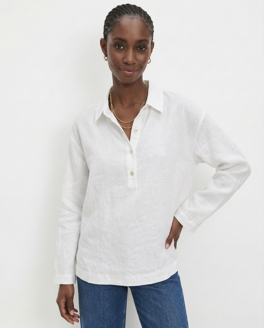 FJØRNA women's linen polo top with collar, lightweight and breathable, worn by a model in a casual setting.