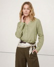 FJØRNA women's linen V-neck shirt, lightweight and breathable, shown on a model as a stylish casual top.