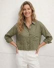 FJØRNA linen crop top for women with pleated long sleeves, displayed on a model, showcasing a stylish and breathable design.