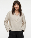Women’s linen polo top with collar by FJØRNA, featuring a relaxed fit and short sleeves in a natural linen fabric.