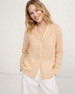 FJØRNA women's linen V-neck shirt, lightweight and breathable top, shown on a female model, casual chic summer clothing