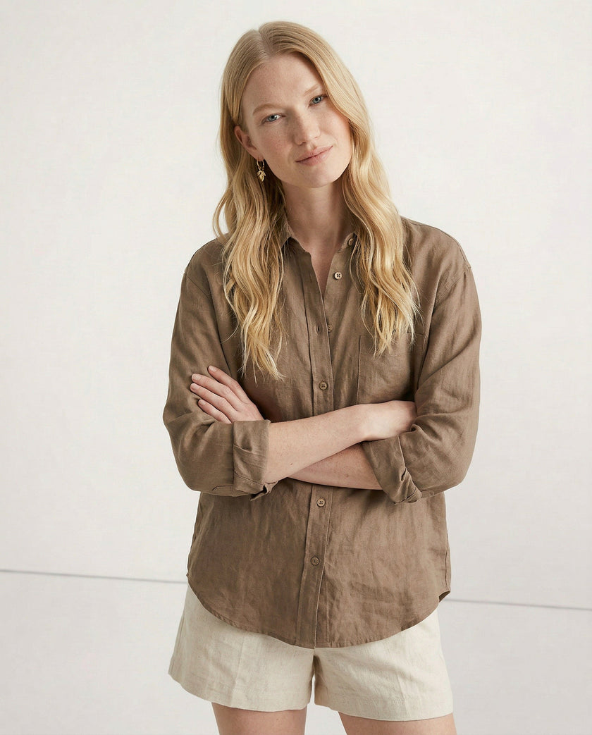 FJØRNA women’s linen shirt with open collar, lightweight and breathable fabric, modeled on a woman, showcasing fabric quality and fit.