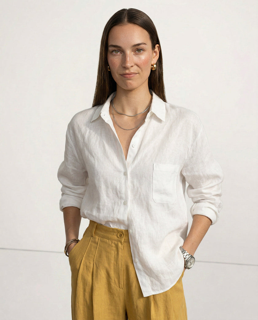 FJØRNA linen women's open collar shirt, lightweight and breathable fabric, shown on model with natural fit and high-quality texture.