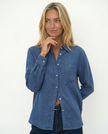 FJØRNA women’s linen blend shirt, casual tops with lightweight, breathable fabric, worn by a female model in a relaxed setting.