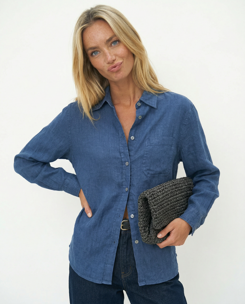 Women’s linen blend shirt by FJØRNA, stylish and breathable top worn by model, featuring a relaxed fit and natural fabric texture.