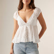 FJØRNA women's summer blouse with V-neck and short sleeves, front view showcasing lightweight, stylish women's top.