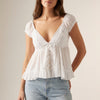 FJØRNA women's summer blouse with V-neck and short sleeves, front view showcasing lightweight, stylish women's top.