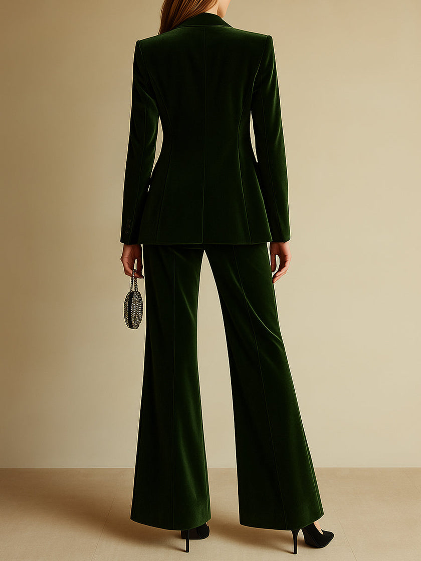 Emerald green loose velvet two-piece suit set by FJØRNA, featuring a stylish blazer and matching trousers.