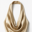 Gold women's halter neck satin maxi dress by FJØRNA, flowing elegant design, perfect for formal occasions and evening wear.