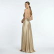 Gold women's halter neck satin maxi dress by FJØRNA, flowing design with elegant straps and smooth fabric.