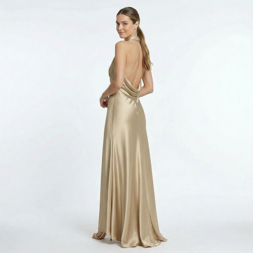Gold women's halter neck satin maxi dress by FJØRNA, flowing design with elegant straps and smooth fabric.
