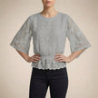 Gray floral lace summer blouse for women by FJØRNA, featuring lightweight fabric and elegant design, perfect for warm weather.