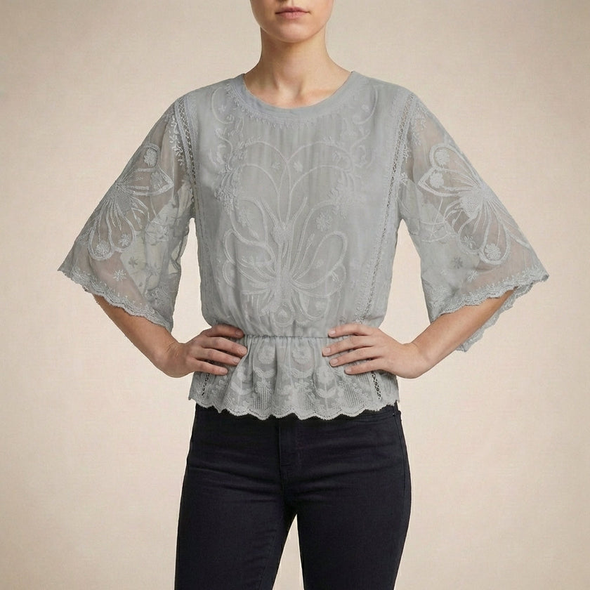 Gray floral lace summer blouse for women by FJØRNA, featuring lightweight fabric and elegant design, perfect for warm weather.