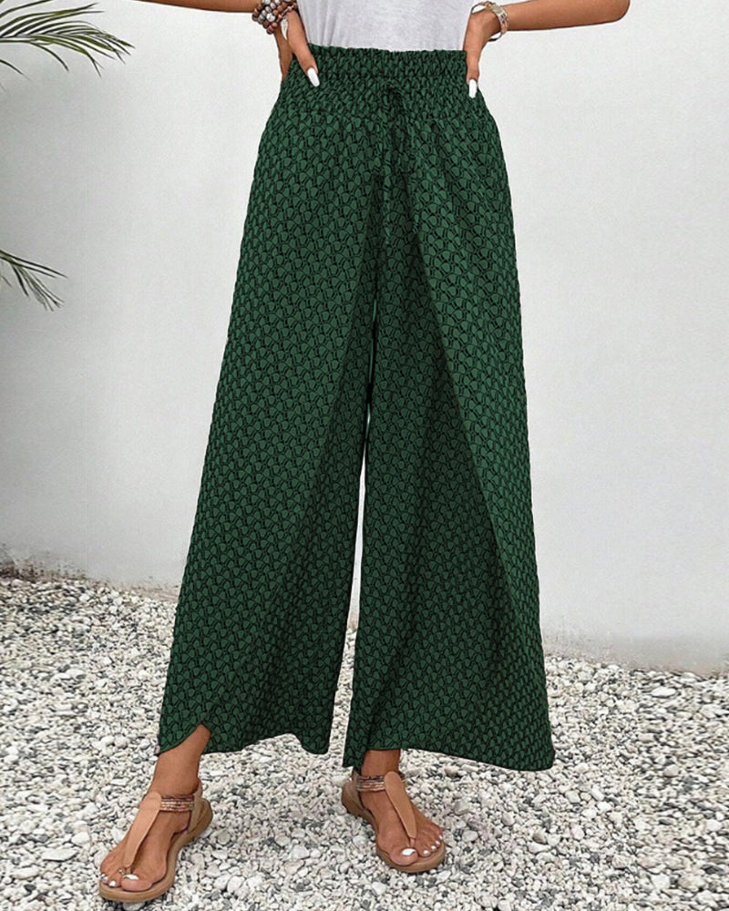 Green FJØRNA women's lightweight summer trousers with wide-leg, breathable, flowy design, perfect for warm weather.
