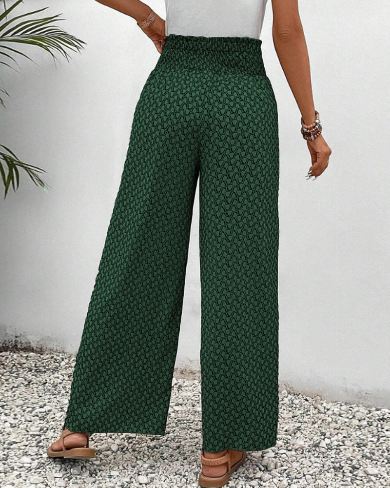 Green FJØRNA lightweight summer trousers for women, wide-leg breathable flowy style, perfect for warm weather.