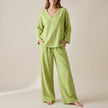 Green FJØRNA women's two-piece co-ord set with V-neck top and pockets, stylish and comfortable for casual wear.