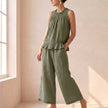 Green FJØRNA women's two-piece co-ord set with ruffle high neck top and matching pants, stylish and elegant for casual or dressy wear.