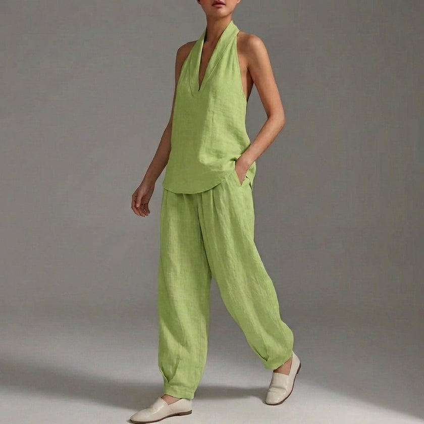 Green FJØRNA lightweight two-piece halter V-neck suit with wide-leg trousers, styled for a relaxed summer look.