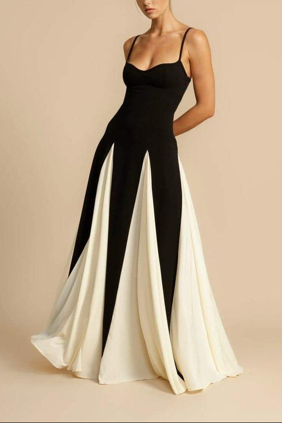 FJØRNA Griselda color block maxi slip dress in white with black accents, flowing sleeveless design, perfect for casual or dressy occasions.