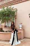 FJØRNA Griselda color block maxi slip dress in black, featuring a flowy silhouette and stylish color blocking design.