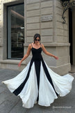 FJØRNA Griselda Color Block Maxi Slip Dress in black, featuring a flowing silhouette and vibrant color blocking design.