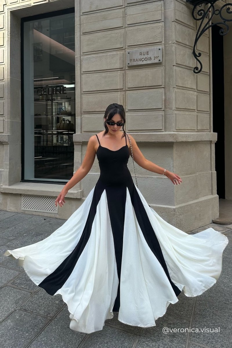 FJØRNA Griselda Color Block Maxi Slip Dress in black, featuring a flowing silhouette and vibrant color blocking design.